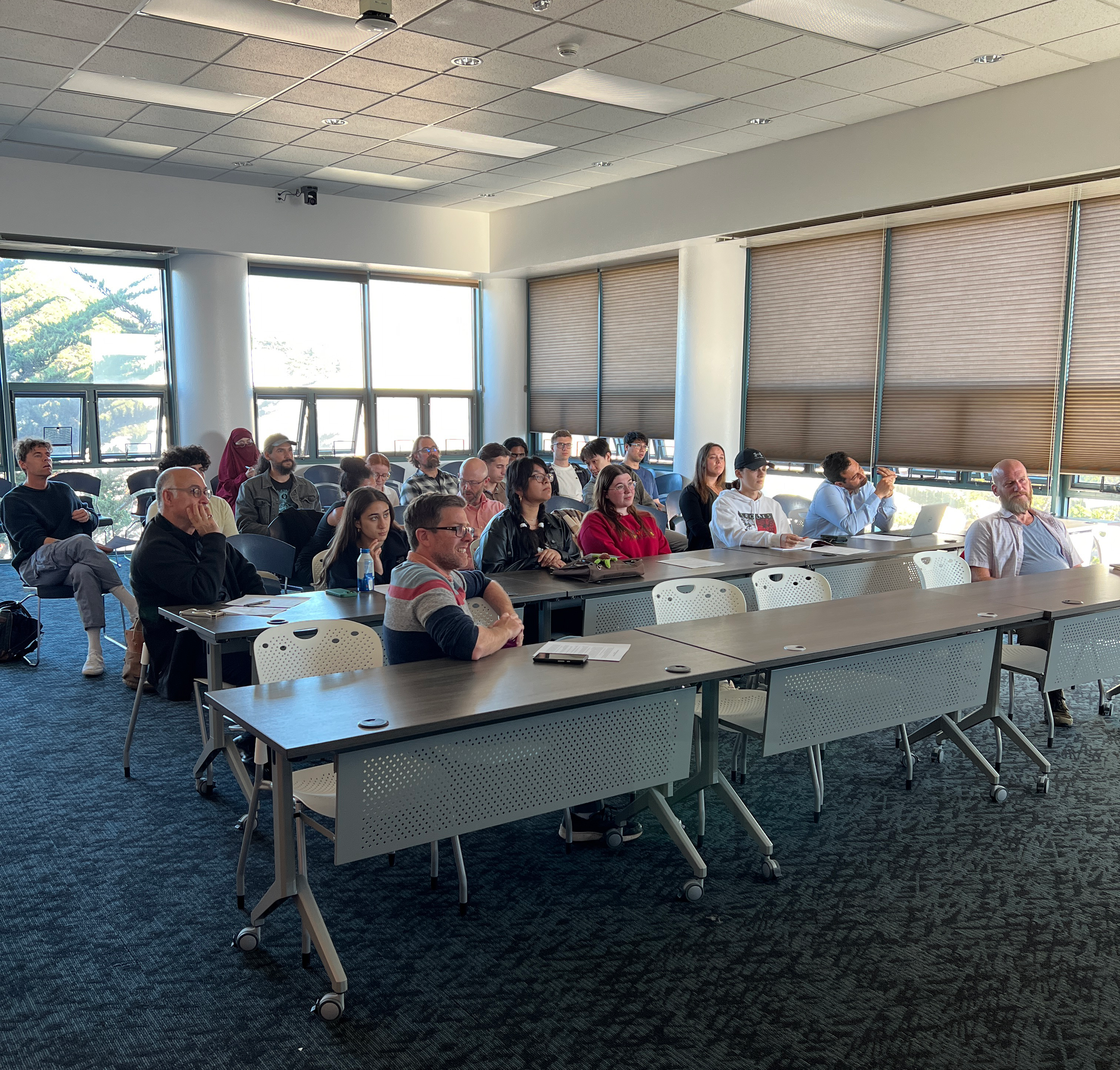 Audience enjoying Keota Fields lecture.