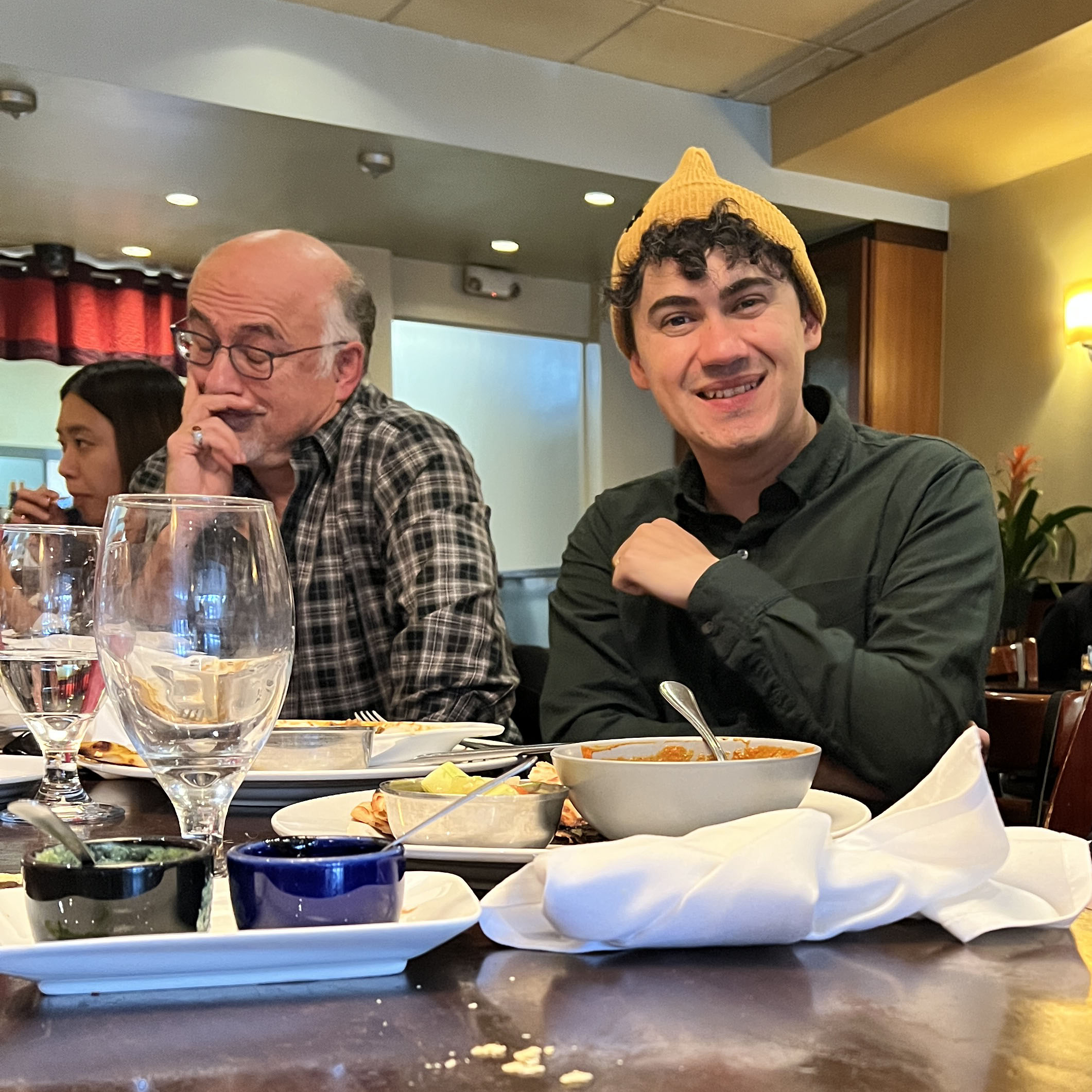 Profs. Azadpur and Sandoval at lunch with grad students.
