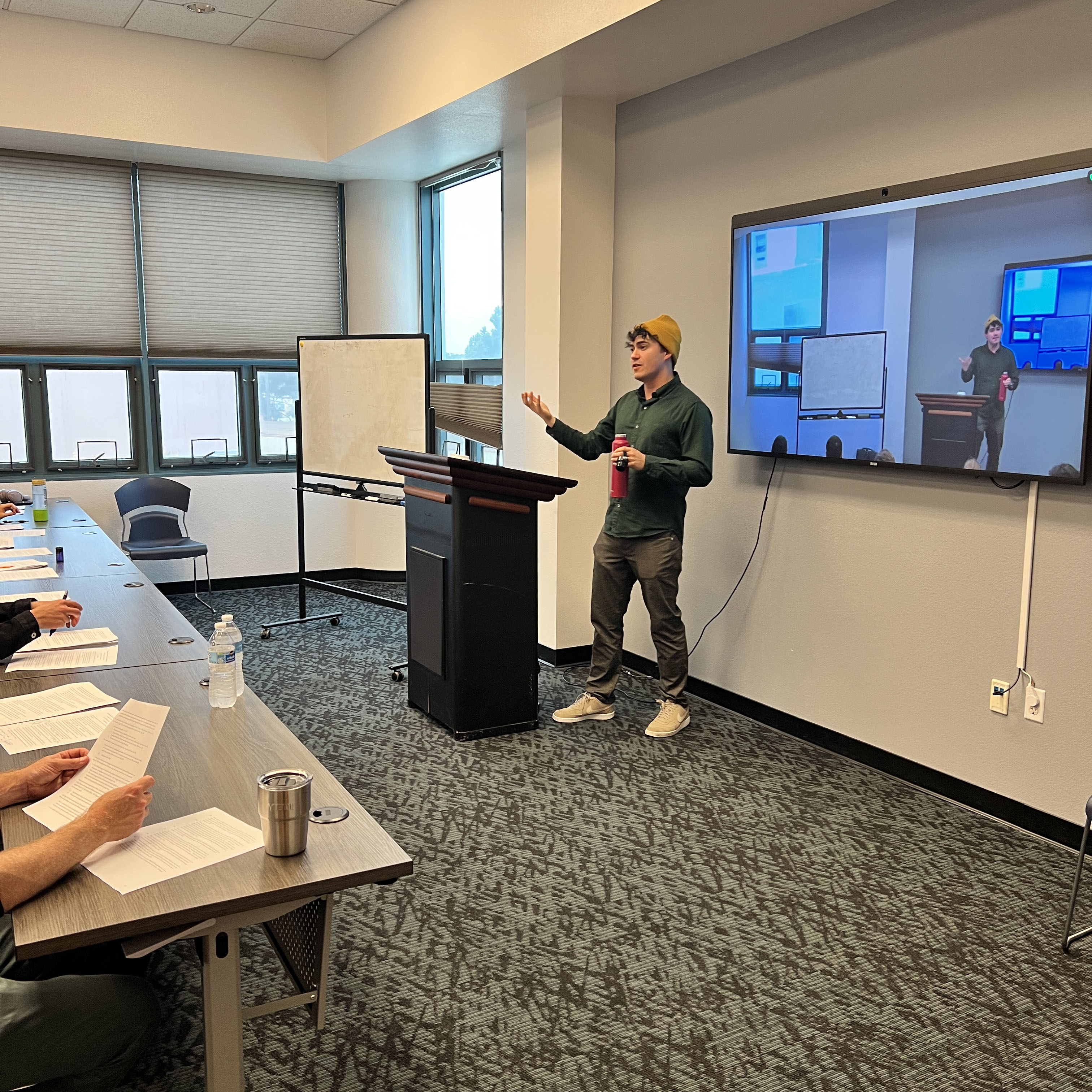 Dr. Sandoval animatedly giving a talk to students.