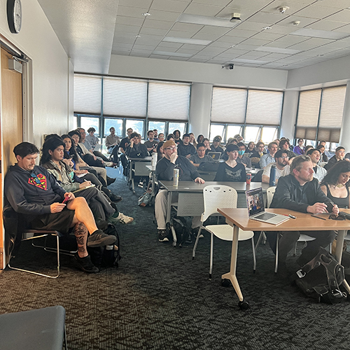Photo of philosophers engrossed in Sullins' talk