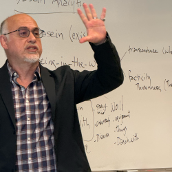 Photo of Mohammad Azadpur teaching.